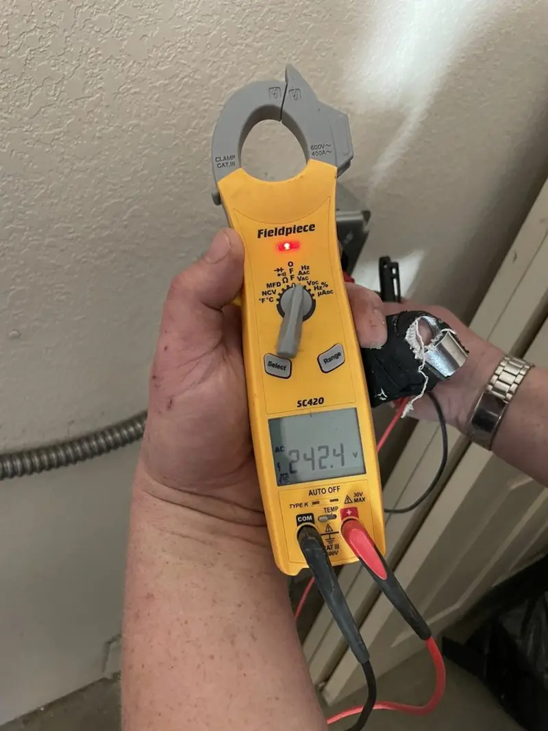 Voltage testing with clamp meter during Recessed Lighting Installation in Merrillville